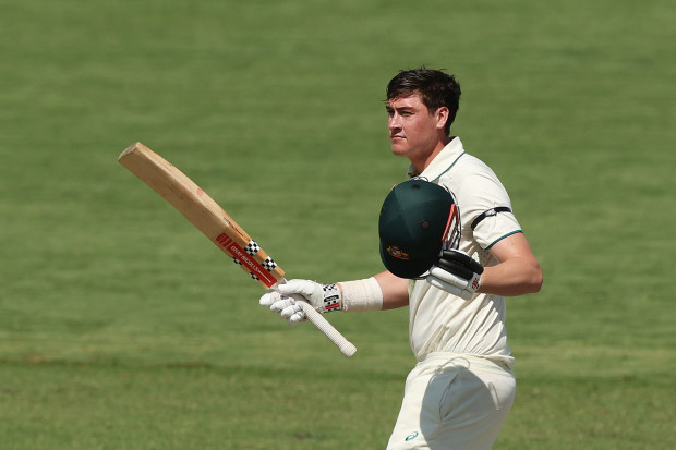 Matt Renshaw celebrates his century for the Prime Minister's XI in Canberra.