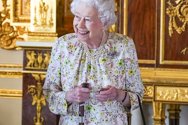 WINDSOR, ENGLAND - MARCH 23: Queen Elizabeth II arrives to view a display of artefacts from British craftwork company, Halcyon Days, to commemorate the company's 70th anniversary in the White Drawing Room at Windsor Castle, on March 23, 2022 in Windsor, England. The Queen viewed a selection of hand-decorated archive enamelware and fine bone china, including their earliest designs from the 1950s. (Photo Steve Parsons - WPA Pool/Getty Images)