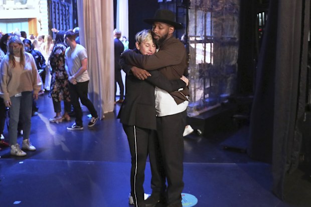 Talk show host Ellen DeGeneres embraces Stephen "tWitch" Boss during a taping of "The Ellen DeGeneres Show" at the Warner Bros. lot in Burbank, Calif. 