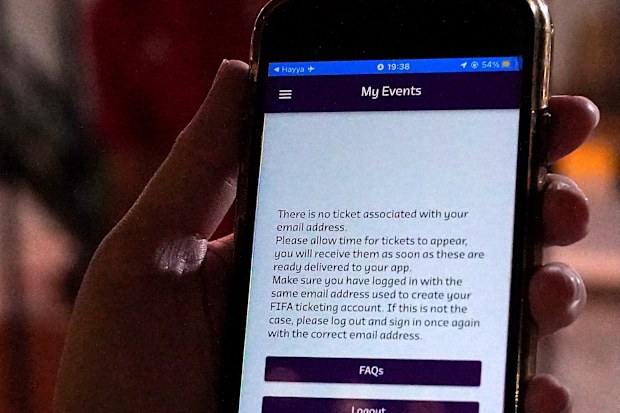 A Wales fan shows an error with their match ticket on the FIFA Qatar 2022 app.