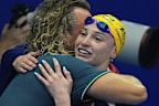 Mollie O'Callaghan and her coach, Dean Boxall, share a warm embrace after her triumph.
