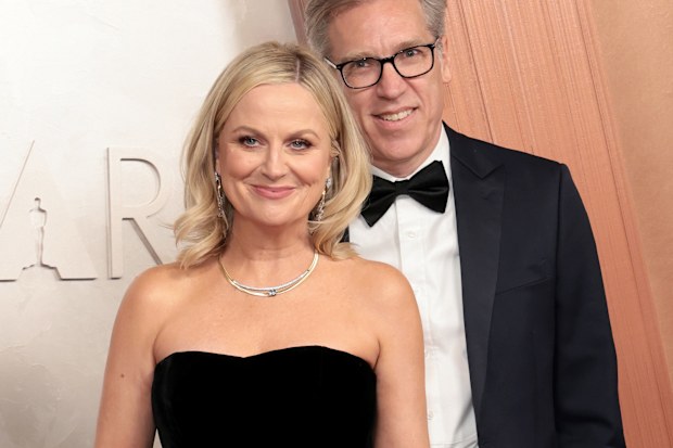 Amy Poehler and Joel Lovell attend the 97th Annual Oscars at Dolby Theatre on March 02, 2025 in Hollywood, California. 