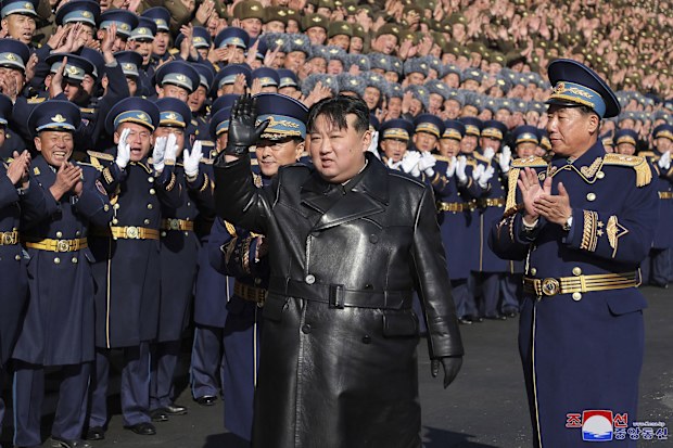 North Korean leader Kim Jong Un waves to participants of the National Mothers' Meeting in Pyongyang, North Korea.