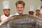 Chef Gordon Ramsay holding a 29 kg Hallibut, poses with catering students from Lewisham college during a photocall to launch National Seafood Week at Billingsgate fish market in east London.   (Photo by Andy Butterton - PA Images/PA Images via Getty Images)