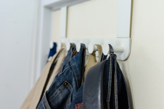 White iron hanging clothes on the door