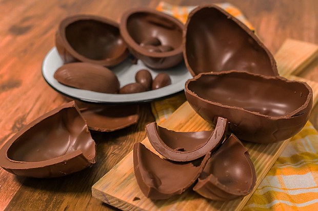 chocolate eggs on wooden background.