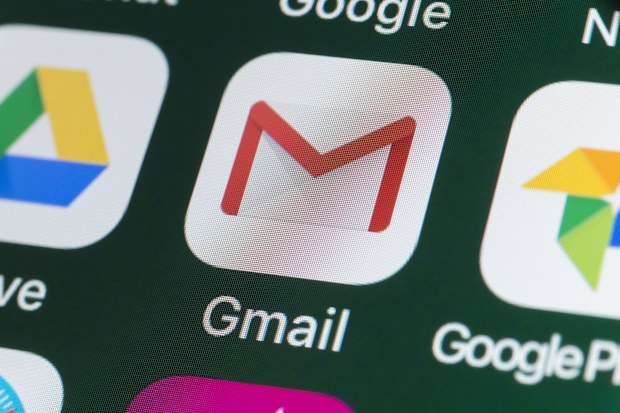 London, UK - July 31, 2018: The buttons of the app Gmail, surrounded by Google, Google Photos, Google Drive and other apps on the screen of an iPhone.