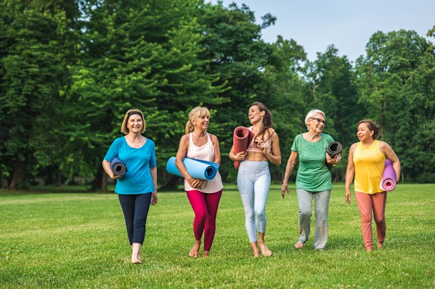 Active elderly people doing sport in the nature