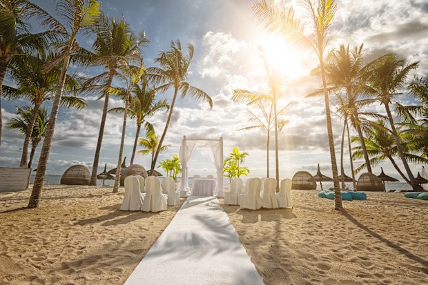 The island Mauritius is a popular destination to celebrate a romantic wedding under palm trees on the white beach. Mauritius, an island state in the Indian Ocean, is also known for its beaches, lagoons and reefs.