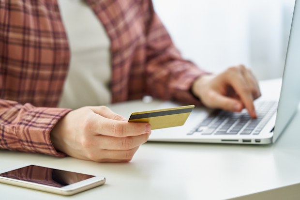 Concept of millennial data privacy and keeping personal information safe online. Booking and purchasing in digitally-connected world. Phishing and scam on Internet. Cybersecurity awareness among youn people