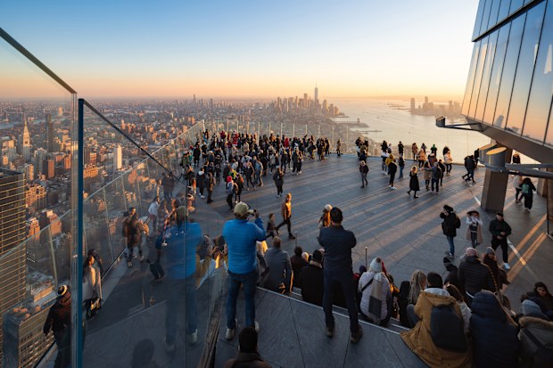 New York City, NY, USA - November 22, 2022: The Edge observation deck with sunset view of Midtown, Lower Manhattan and the Hudson River. 100th floor (1,100 feet) of the supertall skyscraper 30 Hudson Yards