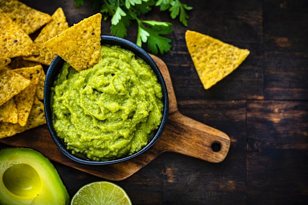 Mexican food: guacamole and nachos shot from above