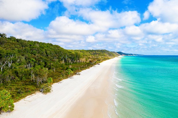 Pristine white sand beach on the western side of Fraser Island, QLD, Australia - K'gari