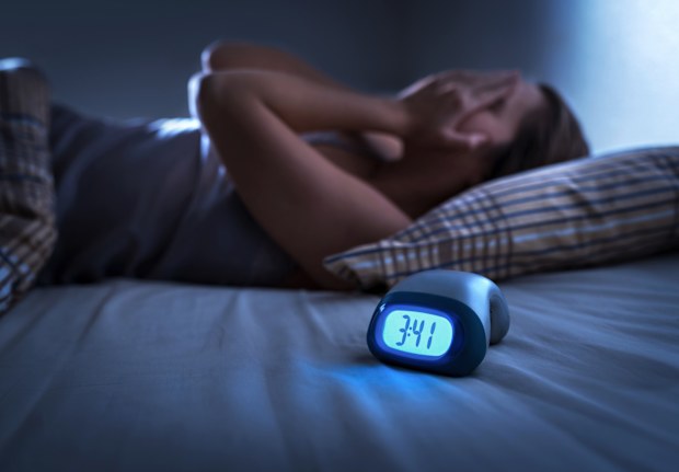 Stressed woman can't sleep