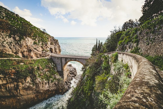 bridge over the fjord of furore at the amalfi coast in italy.