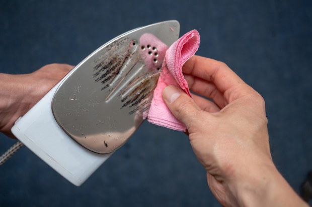 Removal of melted fibers and scrap hardened plastic on the soleplate. 