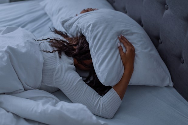 Woman laying in bed, can't sleep