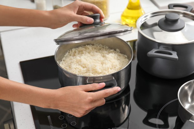 cooking rice on stove in kitchen