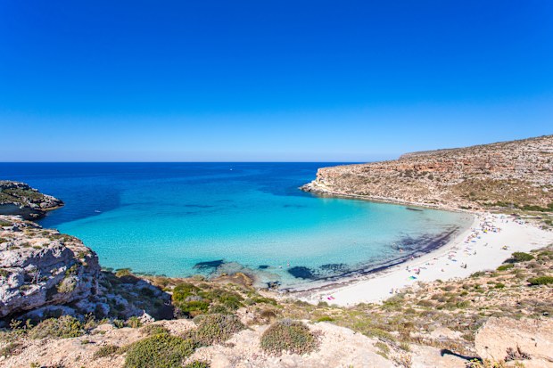 Lampedusa Island Sicily - Rabbit Beach and Rabbit Island  Lampedusa Spiaggia dei Conigli with turquoise water and white sand at paradise beach.