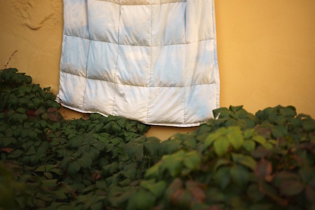 Putting the duvet out of the window to dry
