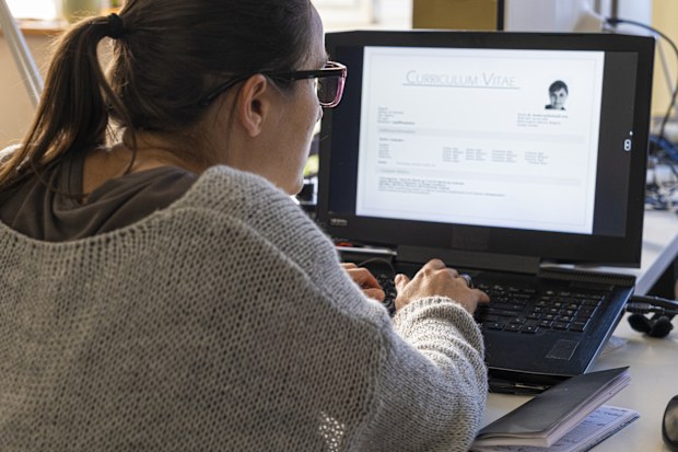 Freelancer professional woman is building CV/Resume online, job hunting through online platforms and applying for work from home. Disrupt aging & work remotely.