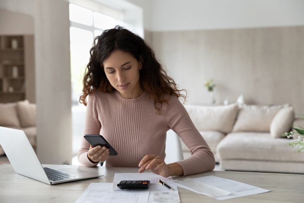 Woman budgeting and paying bills