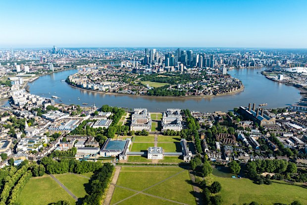 Aerial view of Greenwich park with views to Canary Wharf on summer morning, London