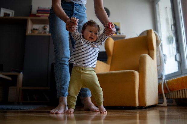 Toddler taking first steps