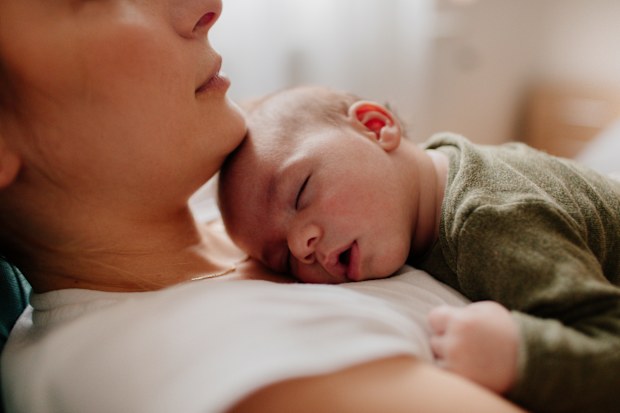 Mum's baby name regret. Mum with newborn