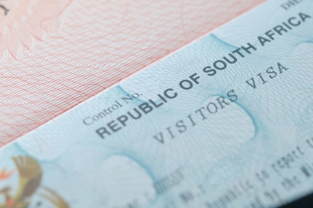 South Africa visa in traveler's passport closeup photo