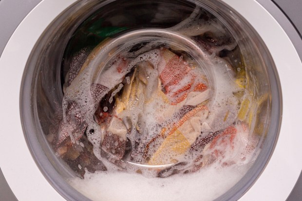 The drum of the washing machine is a close-up. The washing process. 
