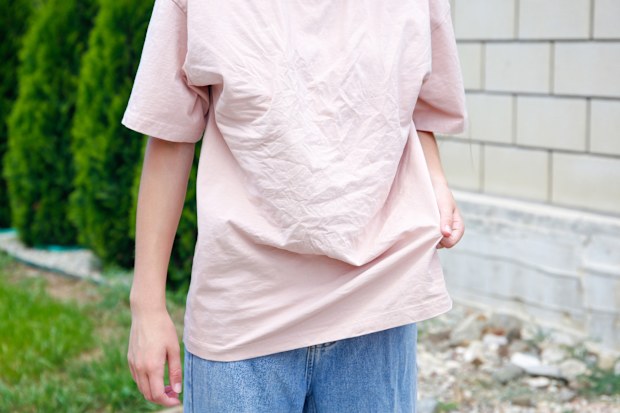 The woman wore a rumpled t-shirt.