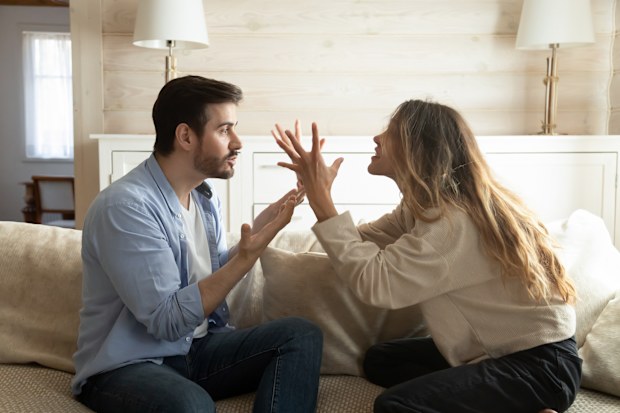 The man laughed at his wife's baby name suggestion.
