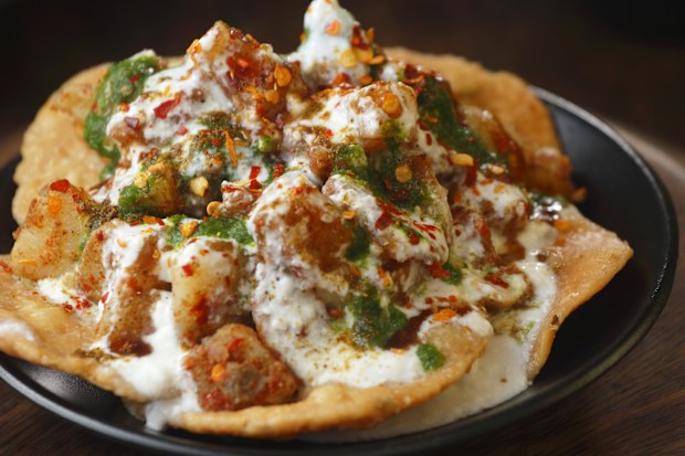 Aloo Papdi Chaat is a delicious North Indian street food made with crispy papdis (fried dough wafers), boiled potatoes (aloo), chickpeas, yogurt, and various chutneys.