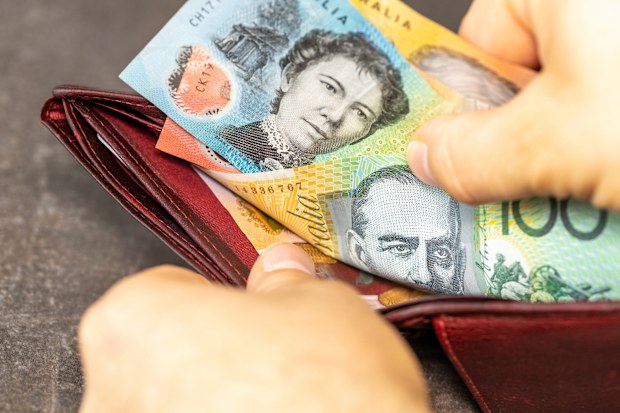 hands opening wallet with Australian money, financial concept. Australia dollar