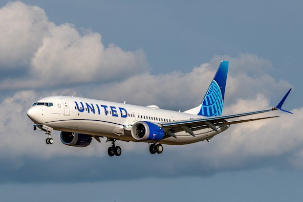Seattle, WA - June 21, 2023: A brand new United Airlines 737 Max 9 arrives back at Seattle, WA after receiving its fresh paint in Portland, Oregon.  The Max 9 is descending on the approach to Boeing Field in Seattle, where it will undergo final test flights and completion before delivery to United.
