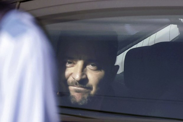 Ukraine's President Volodymyr Zelenskyy is seen in a motorcade vehicle on his way to attend the Group of Seven (G7) nations' meetings Saturday, May 20, 2023, in Hiroshima, western Japan.