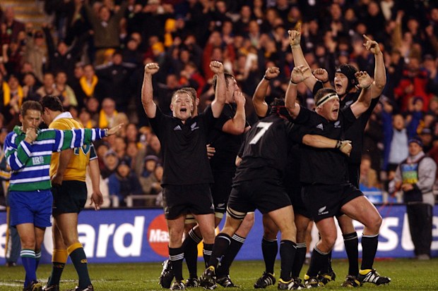 The All Blacks celebrate as referee Jonathan Kaplan blows the final whistle.