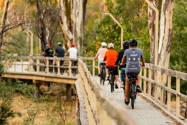 Cyclists Riding along horse shoe lagoon