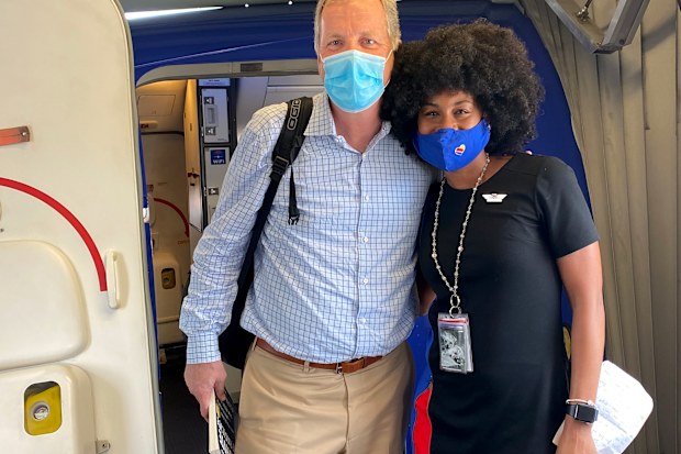 JacqueRae Hill - as she was known before her marriage to Rashard Sullivan this Memorial Day weekend - had a life-changing encounter with passenger Doug Parker on a 2020 flight, and their story went viral.