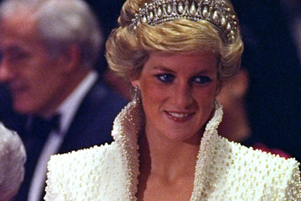 FILE - In this 1989 file photo, Diana, Princess of Wales smiles during an official visit to Hong Kong. This dress is part of an exhibition of 25 dresses and outfits worn by Diana entitled "Diana: Her Fashion Story" at Kensington Palace in London, opening on Friday, Feb. 24, 2017. (AP Photo/Liu Heung Shing, file)