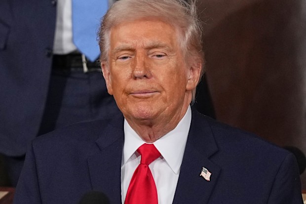 President Donald Trump pauses after delivering the State of the Union address to a joint session of Congress in the House chamber at the U.S. Capitol in Washington, Tuesday, Feb. 24, 2026. (AP Photo/Matt Rourke)