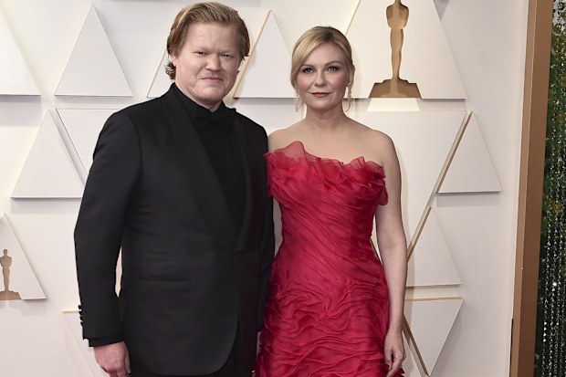 Jesse Plemons, left, and Kirsten Dunst arrives at the Oscars on Sunday, March 27, 2022, at the Dolby Theatre in Los Angeles. 