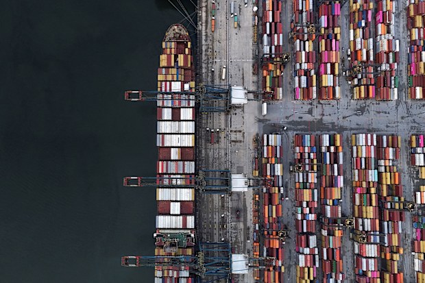 A ship and containers at the Port of Santos, in Santos, Brazil, are seen here in April. President Donald Trump signed executive actions on July 30, implementing a crippling 50% tariff on Brazil.