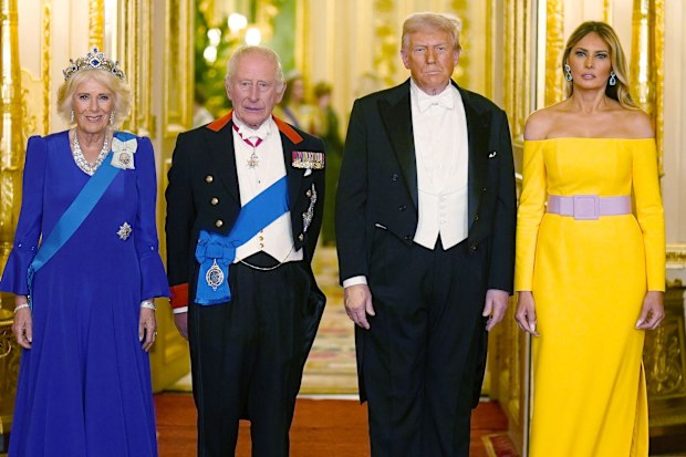 Britain's King Charles III, centre left, and U.S. President Donald Trump, centre right, pose with Queen Camilla and First Lady Melania Trump, right, at the state banquet at Windsor Castle, England, on day one of the president's second state visit to the UK, Wednesday Sept. 17, 2025. (Aaron Chown/PA via AP, Pool)