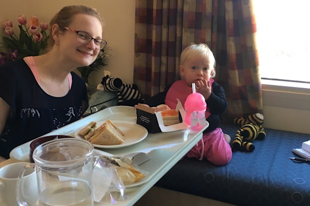 Natalie Diepenhorst in hospital with her baby daughter at her side.