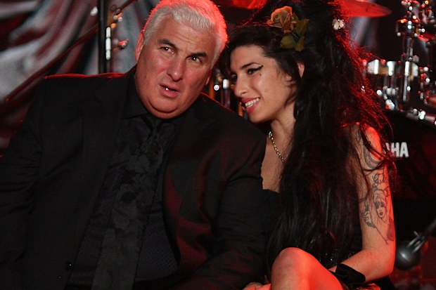 British singer Amy Winehouse with her dad Mitch Winehouse at The Riverside Studios for the 50th Grammy Awards ceremony via video link on February 10, 2008 in London, England.