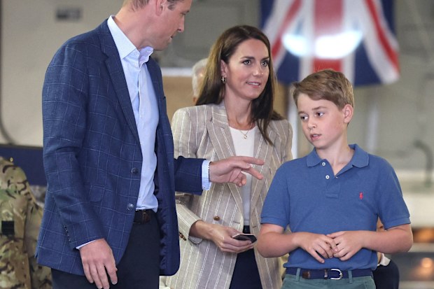 Britain's Prince William, Prince of Wales and Catherine, Princess of Wales with Prince George of Wales as they walk down the ramp of a C17 place during their visit to the Air Tattoo at RAF Fairford on July 14, 2023 in Fairford, Britain.      Chris Jackson/Pool via REUTERS