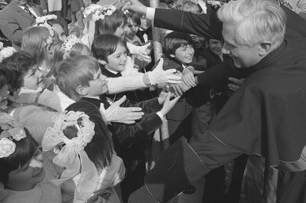 Joseph Ratzinger, archbishop of Munich and Freising, greets children in front of the Ramersdorfer Marienkirche (church of Mary) after being nominated archbishop on May 23, 1977. 