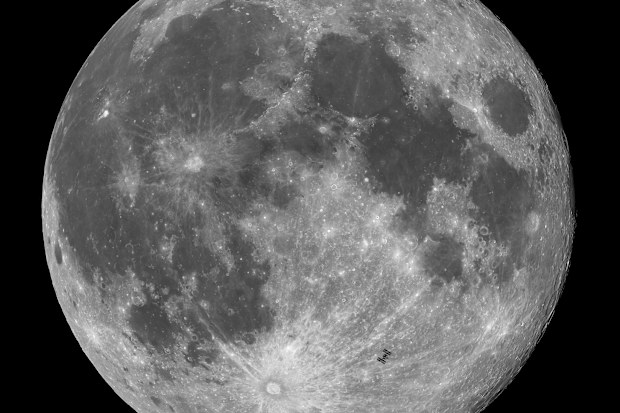 This image captures the International Space Station (ISS) in transit across October's Full Moon, the Hunter's Moon, approximately 12 hours after a partial lunar eclipse. The striking beauty of the Full Moon is on display, with its mix of rugged highlands, bright crater rays and darker maria. 